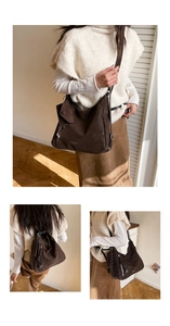 Detail view of large brown retro tote with wide strap and matching mini pouch