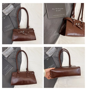 Detailansicht einer dunkelbraunen matten Ledertasche mit dekorativer Schnalle und Riemen