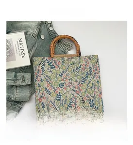 Detailed view of floral linen tote bag with authentic bamboo handle and spacious design