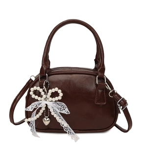 Dark brown oil wax leather handbag with pearl bow charm and detachable shoulder strap