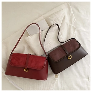 Close-up of matte and smooth leather patchwork texture on burgundy and brown flap bags