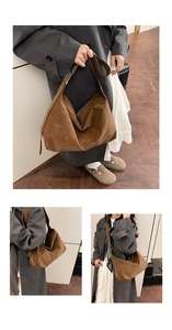 Detail view of large dark brown suede tote bag featuring premium matte texture and wide strap
