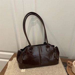 Retro dark brown glossy leather tote bag with long straps and spacious interior