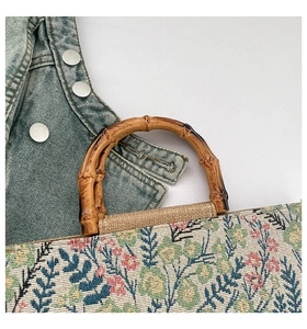 Close-up of bamboo handle and floral fabric texture on the stylish tote bag
