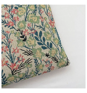 Close-up of high-density floral jacquard fabric with colorful woven flower patterns