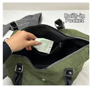 Detail shot of green suede handbag interior showing functional black zippered pocket