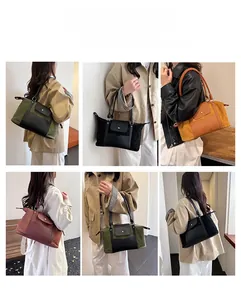 Detail view of large capacity travel bags in various colors with smooth leather patchwork