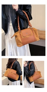 Detail view of mustard yellow large capacity travel tote bag with metal zipper and handles