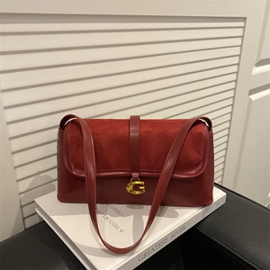 Chic burgundy underarm bag with gold G-buckle on white decorative background