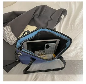 Large capacity denim tote interior view showing tablet, phone and cosmetics storage