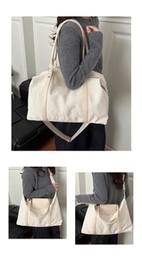 Detail showing creamy white quilted texture tote bag with versatile carrying options