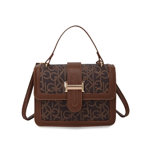 Retro brown monogram crossbody bag with golden metal buckle and adjustable strap