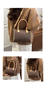 Detail view of windmill pattern Boston bag with leather handles and red edge oil finish