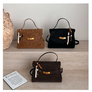 Retro matte Kelly style bags in brown and black with wooden beaded charm detail