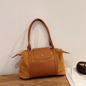 Vintage brown suede handbag for women featuring top handles and silver buckle detail