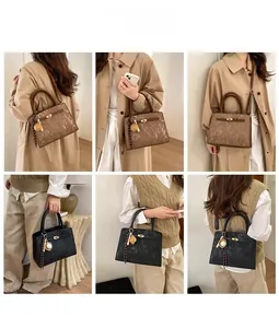 Detail view of leather handbags in black and brown with metal buckles and textures