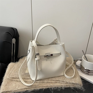 Classic white pebble leather bucket bag with silver metal lock and adjustable strap