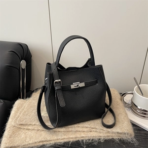 Elegant black lychee grain leather bucket bag with silver buckle and crossbody strap