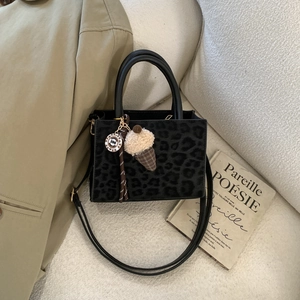 Fashionable leopard print tote bag with adjustable shoulder strap and cute pendants