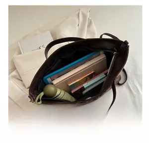 Interior detail of large leopard print tote bag showing capacity for iPad and books