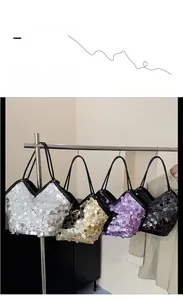 Detail view of large capacity sequin tote bags in silver, gold, purple and black colors