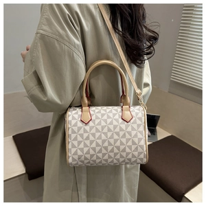 Detail view of the vintage Boston bag showing red oil-edge finish and geometric patterns