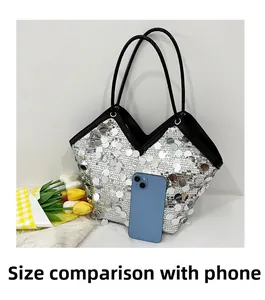 Silver sequin tote bag size comparison with smartphone showing practical interior space