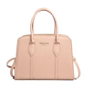 Chic beige crocodile embossed leather tote bag with sturdy handles and shoulder strap