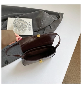 Top-down view showing the spacious interior compartment of this retro leather baguette bag