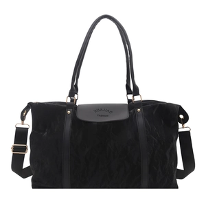 Large black minimalist tote bag with waterproof nylon texture and adjustable shoulder strap
