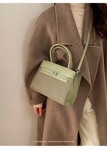 Detail of light green leather and textured weave crossbody bag with metal twist lock