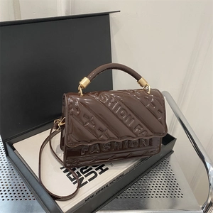 Chic dark coffee patent leather handbag with FASHION embossing and gold metal handles