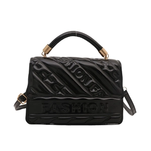 Fashionable black patent leather shoulder bag with embossed letters and metal handle