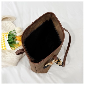 Top view of large brown vintage tote bag with interior zipper pocket and silk scarf decor
