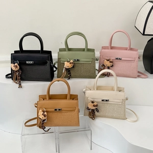 Minimalist crossbody bag with leather weave texture and silver twist lock in five colors