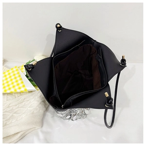 Detail view of the spacious inner compartment with brown lining and zipper pocket