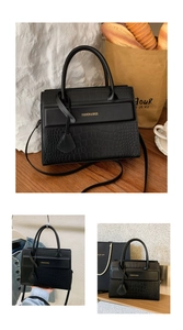 Close-up of black crocodile pattern leather tote bag with elegant gold branding and handles