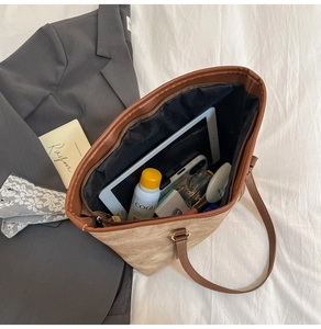Top-down view of large tote bag with organized interior storage for tablet and cosmetics