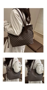 Detail of coffee brown tote bag with M-pattern jacquard and leather shoulder straps