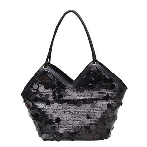 Fashionable black sequin tote bag with sleek leather straps and elegant V-shaped trim
