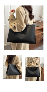 Détail du grand sac cabas en cuir grainé noir avec bandoulière chaîne gris foncé