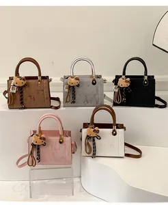 Sacs à main en cuir mat en cinq couleurs avec bandoulière réglable et breloque chat