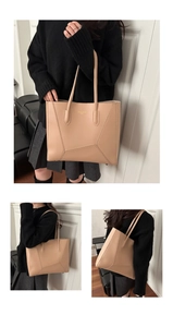Three-way view of beige faux leather tote bag with gold lettering and shoulder straps