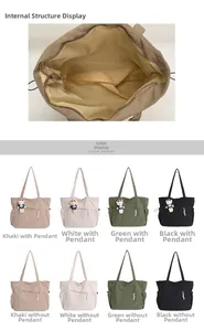 Detailed interior view and color options of the striped corduroy tote bag with zipper