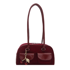 Burgundy velvet shoulder bag with leather straps and a cherry charm detail