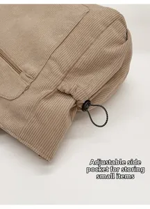 Detailed macro of khaki corduroy tote featuring an adjustable drawstring side pocket
