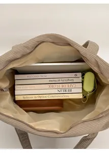 Spacious beige corduroy tote bag showing large capacity for books and tablet