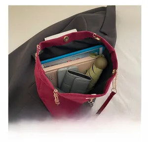 Top view of large capacity burgundy suede tote bag showing storage space for laptop and phone