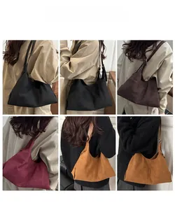 Collage of model wearing large suede hobo bags in black, coffee, burgundy and mustard