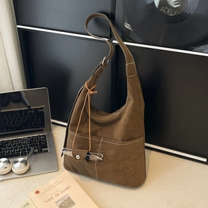 Brown suede tote bag with large capacity, stitching detail and glasses case accessory